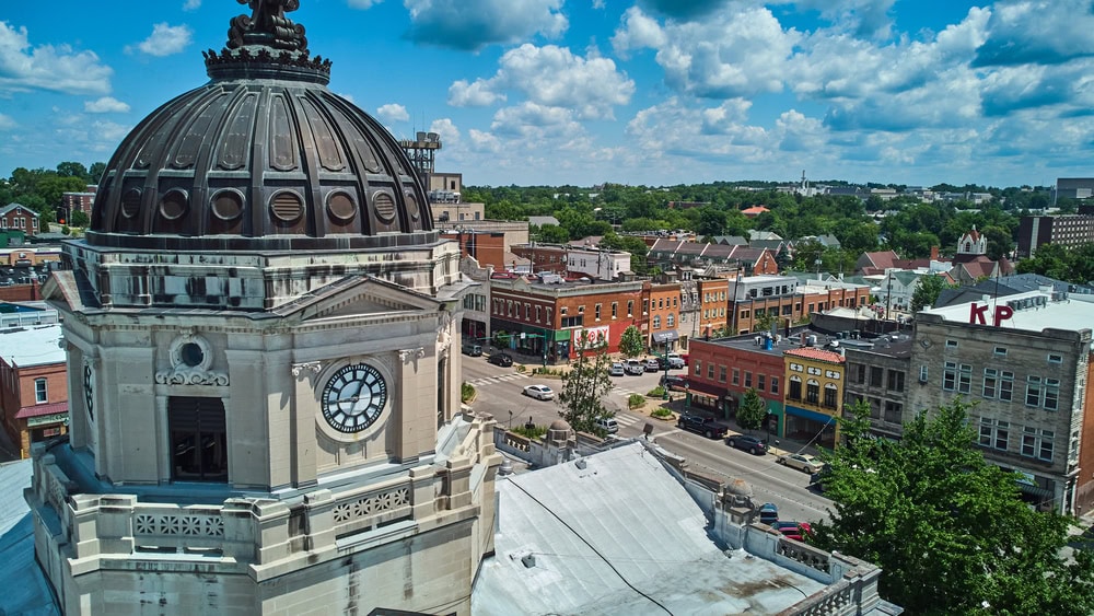 Explore Bloomington Indiana's Hoosier Heartland with an aerial view of the city, showcasing a spectacular clock tower.